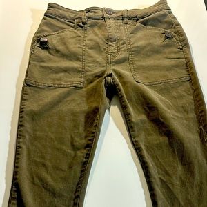 Size 27 olive green moto type pants. Skinny leg with zipper at ankles.